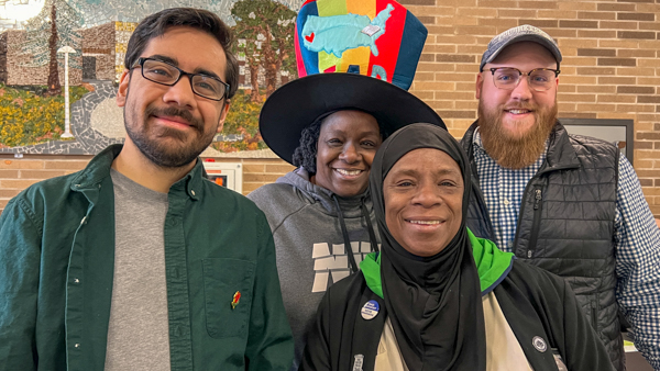 Stack of children's books and coloring supplies distributed at the free literacy event