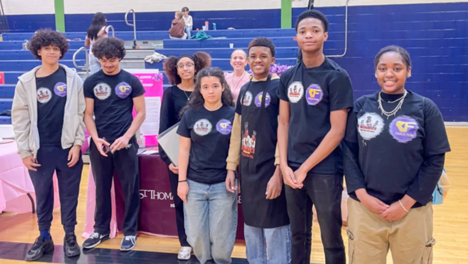 Children leaving the Books and Breakfast event with armfuls of books and crafts
